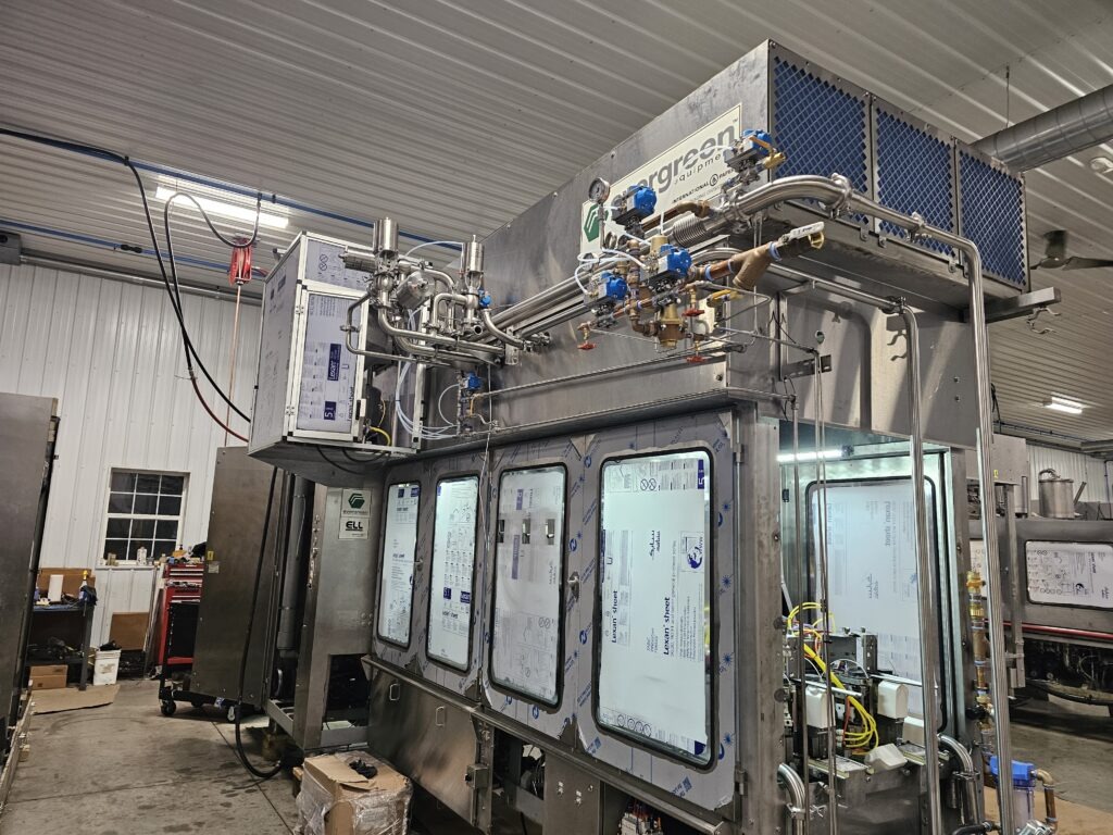 Industrial processing equipment with visible pipes and valves